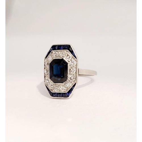 115 - A LOVELY VINTAGE ART DECO SAPPHIRE & DIAMOND CLUSTER RING, with an octagonal shaped central sapphire... 