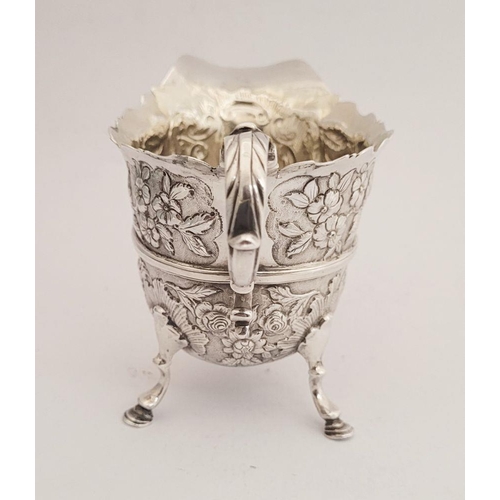 116 - A BEAUTIFULLY CRAFTED IRISH, CORK, GEORGE II SILVER CREAM JUG, finely decorated all over with repous... 