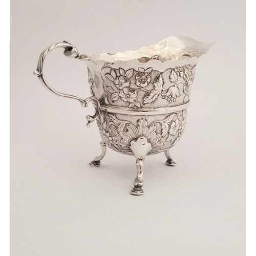 116 - A BEAUTIFULLY CRAFTED IRISH, CORK, GEORGE II SILVER CREAM JUG, finely decorated all over with repous... 