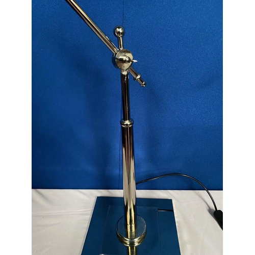 119 - A GOOD ADJUSTABLE CHROME DESK LAMP, the arm can be adjusted, on stepped square base. Dimensions: bas... 