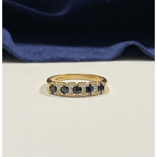 120 - A BEAUTIFUL 9CT YELLOW GOLD SAPPHIRE & DIAMOND BAND RING, with five round cut sapphires separated by... 