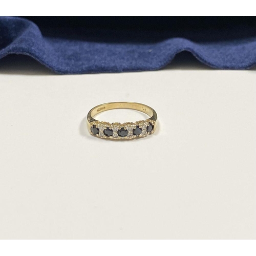 120 - A BEAUTIFUL 9CT YELLOW GOLD SAPPHIRE & DIAMOND BAND RING, with five round cut sapphires separated by... 