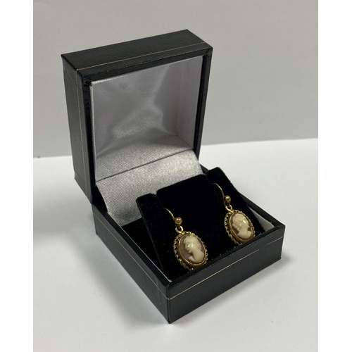 128 - A PAIR OF 9CT YELLOW GOLD CAMEO DROP EARRINGS, finely carved oval cameos within rope bordered 9ct ye... 