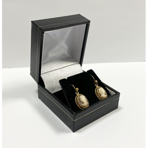 128 - A PAIR OF 9CT YELLOW GOLD CAMEO DROP EARRINGS, finely carved oval cameos within rope bordered 9ct ye... 