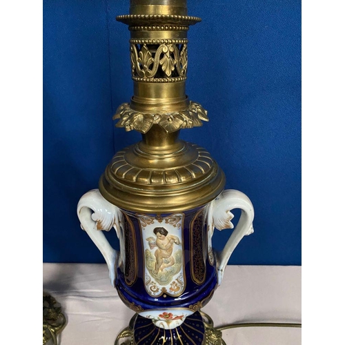 14 - A GOOD PAIR OF DRESDEN STYLE PORCELAIN BRASS MOUNTED LAMPS, the bodies of urn form, each double hand... 