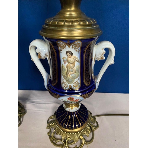 14 - A GOOD PAIR OF DRESDEN STYLE PORCELAIN BRASS MOUNTED LAMPS, the bodies of urn form, each double hand... 