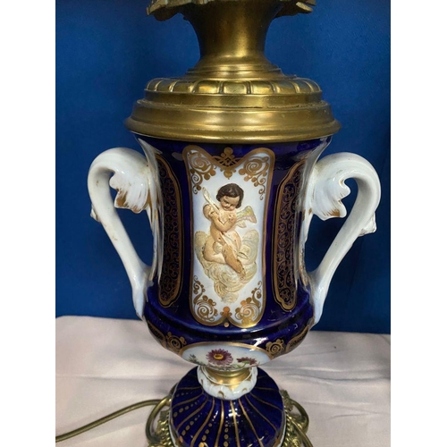 14 - A GOOD PAIR OF DRESDEN STYLE PORCELAIN BRASS MOUNTED LAMPS, the bodies of urn form, each double hand... 