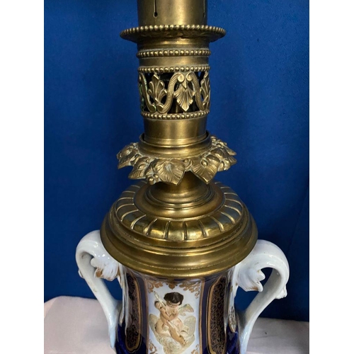 14 - A GOOD PAIR OF DRESDEN STYLE PORCELAIN BRASS MOUNTED LAMPS, the bodies of urn form, each double hand... 