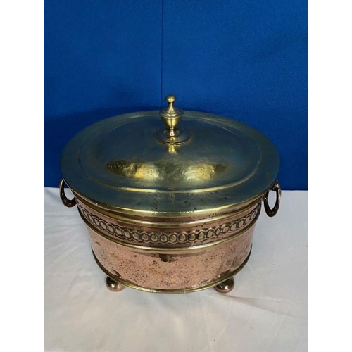 142 - A COPPER & BRASS OVAL SHAPED LOG/COAL BOX, the copper body with embossed panel, horse shoe handles t... 