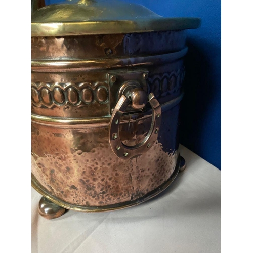 142 - A COPPER & BRASS OVAL SHAPED LOG/COAL BOX, the copper body with embossed panel, horse shoe handles t... 