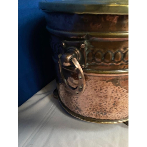 142 - A COPPER & BRASS OVAL SHAPED LOG/COAL BOX, the copper body with embossed panel, horse shoe handles t... 