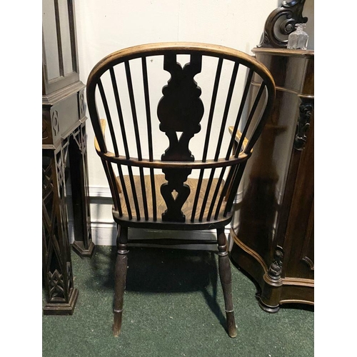 148 - A FINE 19TH CENTURY WINDSOR ARMCHAIR, the arched backrest with carved central splat over shaped seat... 