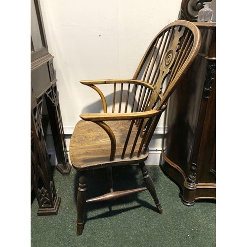 148 - A FINE 19TH CENTURY WINDSOR ARMCHAIR, the arched backrest with carved central splat over shaped seat... 