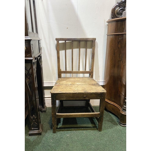 149 - A VINTAGE PROVINCIAL STYLE OAK DINING CHAIR, with four bar slatted back, straight legs joined by cro... 