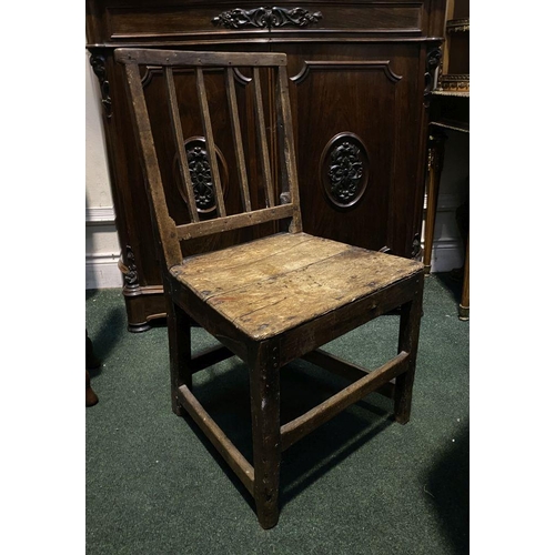 149 - A VINTAGE PROVINCIAL STYLE OAK DINING CHAIR, with four bar slatted back, straight legs joined by cro... 