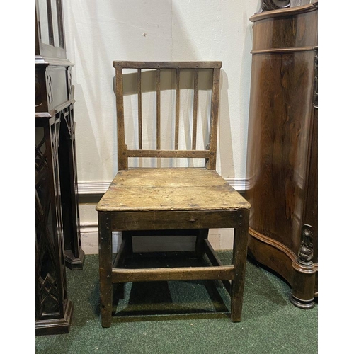 149 - A VINTAGE PROVINCIAL STYLE OAK DINING CHAIR, with four bar slatted back, straight legs joined by cro... 