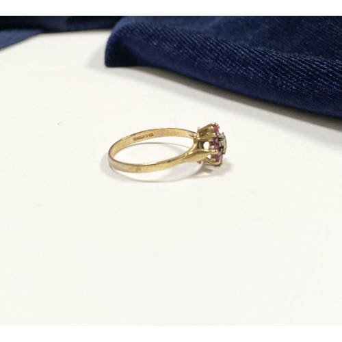 158 - A BEAUTIFUL DAINTY 9CT YELLOW GOLD DIAMOND & RUBY CLUSTER RING, with central illusion set round cut ... 