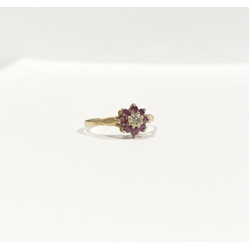 158 - A BEAUTIFUL DAINTY 9CT YELLOW GOLD DIAMOND & RUBY CLUSTER RING, with central illusion set round cut ... 