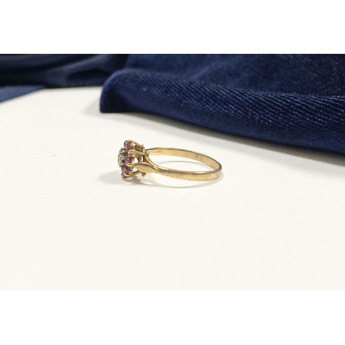 158 - A BEAUTIFUL DAINTY 9CT YELLOW GOLD DIAMOND & RUBY CLUSTER RING, with central illusion set round cut ... 