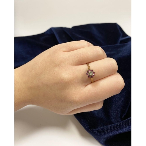 158 - A BEAUTIFUL DAINTY 9CT YELLOW GOLD DIAMOND & RUBY CLUSTER RING, with central illusion set round cut ... 