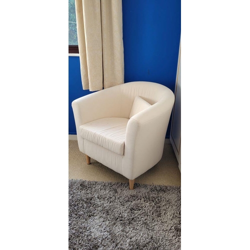 160 - A CONTEMPORARY CURVED CREAM COLOURED ARMCHAIR, with left out cushion to the seat, raised on rounded ... 