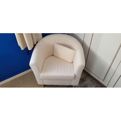 160 - A CONTEMPORARY CURVED CREAM COLOURED ARMCHAIR, with left out cushion to the seat, raised on rounded ... 