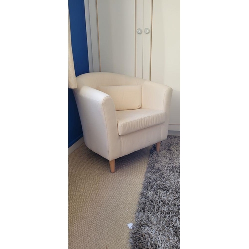 160 - A CONTEMPORARY CURVED CREAM COLOURED ARMCHAIR, with left out cushion to the seat, raised on rounded ... 