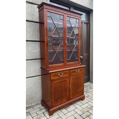 166 - AN EXCELLENT QUALITY IRISH MAHOGANY INLAID ASTRAGAL GLAZED LIBRARY BOOKCASE, to the top a dentil dec... 