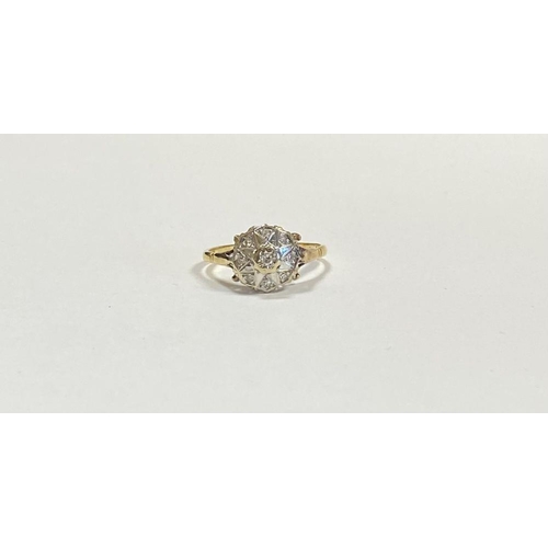 17 - A STRIKING 18CT YELLOW GOLD ART DECO STYLE DIAMOND CLUSTER RING, with central round cut diamond in i... 