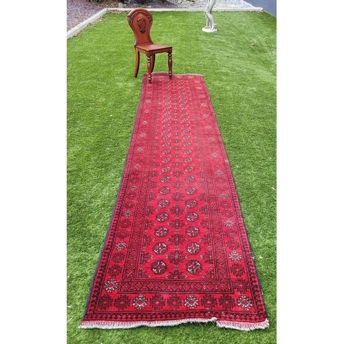 18 - A TRADITIONAL AFGHAN RUNNER RUG, hand knotted with beautiful vegetable dyed yarn, pure wool. This ru... 