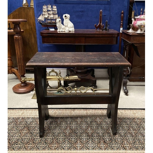 181 - A DARK STAINED HARDWOOD STOOL/BENCH, with shaped supports joined by a cross stretcher. The supports ... 