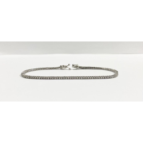 2 - A FANTASTIC 14CT WHITE GOLD DIAMOND TENNIS BRACELET, with 3.50cts total diamonds, complete with safe... 