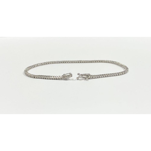 2 - A FANTASTIC 14CT WHITE GOLD DIAMOND TENNIS BRACELET, with 3.50cts total diamonds, complete with safe... 