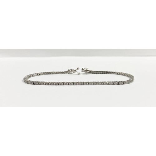 2 - A FANTASTIC 14CT WHITE GOLD DIAMOND TENNIS BRACELET, with 3.50cts total diamonds, complete with safe... 