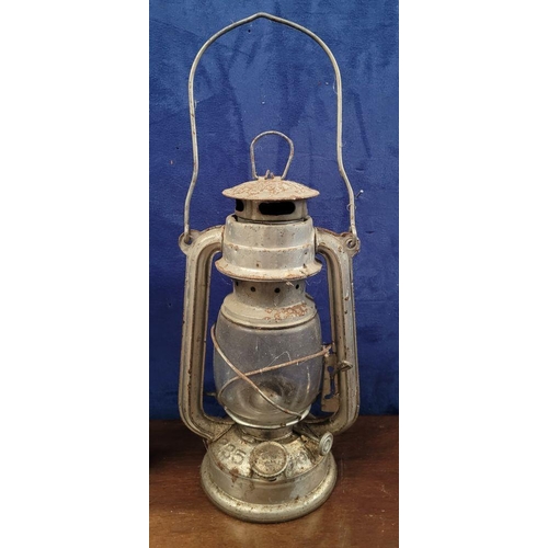 201 - TWO VINTAGE OIL LAMPS, (i) A vintage Anchor Brand kerosene lamp, with swing handle, numbered 235, 36... 