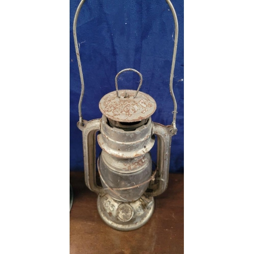 201 - TWO VINTAGE OIL LAMPS, (i) A vintage Anchor Brand kerosene lamp, with swing handle, numbered 235, 36... 