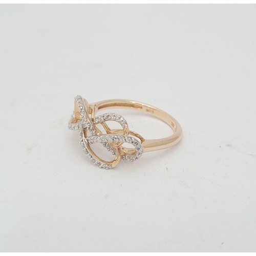 21 - A LOVELY 10CT YELLOW GOLD & DIAMOND DOUBLE INFINITY KNOT RING, a really pretty design, with a ribbon... 