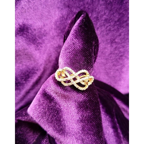 21 - A LOVELY 10CT YELLOW GOLD & DIAMOND DOUBLE INFINITY KNOT RING, a really pretty design, with a ribbon... 