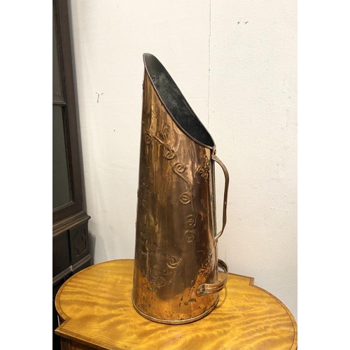 217 - A VINTAGE COPPER COAL SCUTTLE, with two handles and embossed design to body. Dimensions: 55cm high a... 