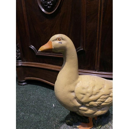 219 - A VINTAGE PAINTED CAST METAL DOOR STOP, in the form of Easter Goose. Dimensions: 32cm high approx.