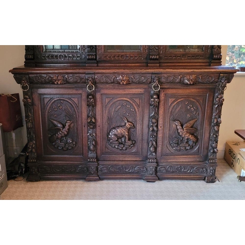 22 - A VERY FINE & LARGE FRENCH CARVED OAK STAINED GLAZED HUNT SIDEBOARD CABINET, circa 1800s, with a car... 