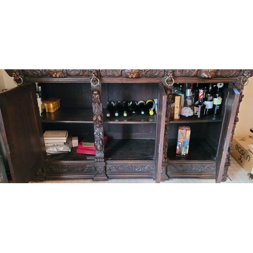 22 - A VERY FINE & LARGE FRENCH CARVED OAK STAINED GLAZED HUNT SIDEBOARD CABINET, circa 1800s, with a car... 