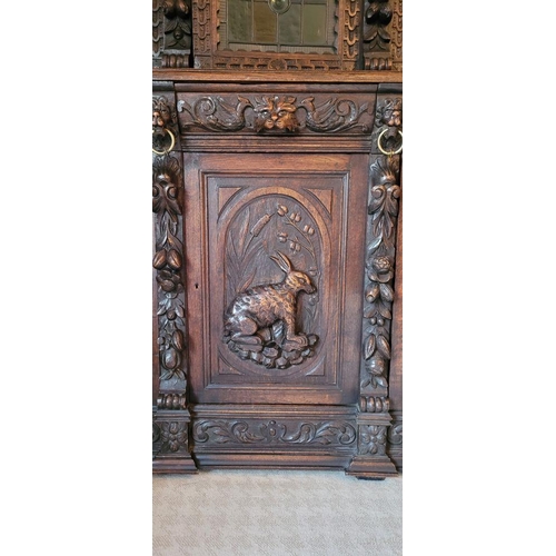 22 - A VERY FINE & LARGE FRENCH CARVED OAK STAINED GLAZED HUNT SIDEBOARD CABINET, circa 1800s, with a car... 