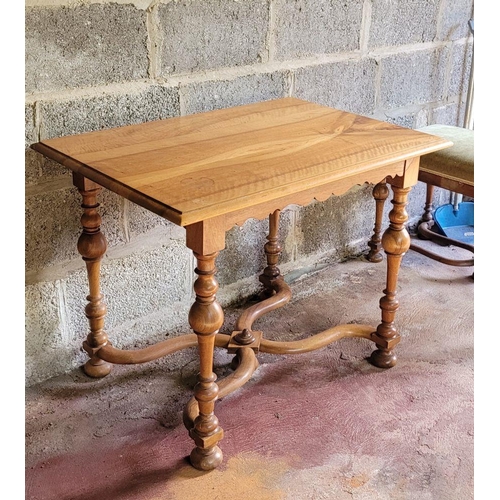 222 - A GOOD QUALITY NEATLY SIZED TABLE, with scalloped detail to the skirt, raised on turned upright supp... 