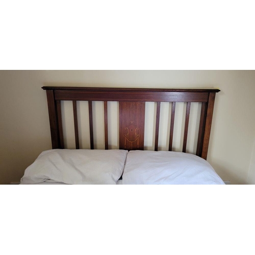 223 - AN EARLY 20TH CENTURY MAHOGANY & SATINWOOD INLAID BED HEADBOARD, with an 8 bar open back having a ce... 