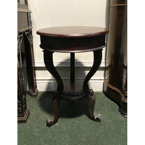 231 - A MAHOGANY CIRCULAR TOPPED OCCASIONAL TABLE, with three shaped supports joined by circular undertier... 