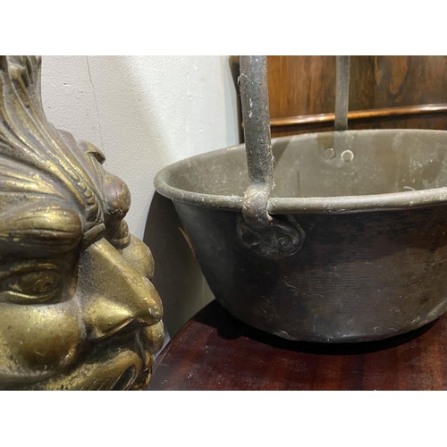 240 - A HEAVY BRASS POT ALONG WITH CAST METAL MASK, dimensions: pot: 33cm diameter; mask: 25.5cm high appr... 