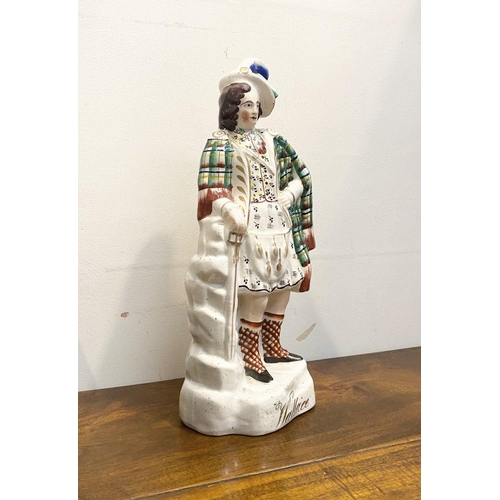 241 - A LARGE LATE 19TH CENTURY STAFFORDSHIRE FIGURE OF SIR WILLIAM WALLACE. The figure is standing on a s... 