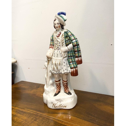 241 - A LARGE LATE 19TH CENTURY STAFFORDSHIRE FIGURE OF SIR WILLIAM WALLACE. The figure is standing on a s... 