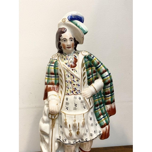 241 - A LARGE LATE 19TH CENTURY STAFFORDSHIRE FIGURE OF SIR WILLIAM WALLACE. The figure is standing on a s... 